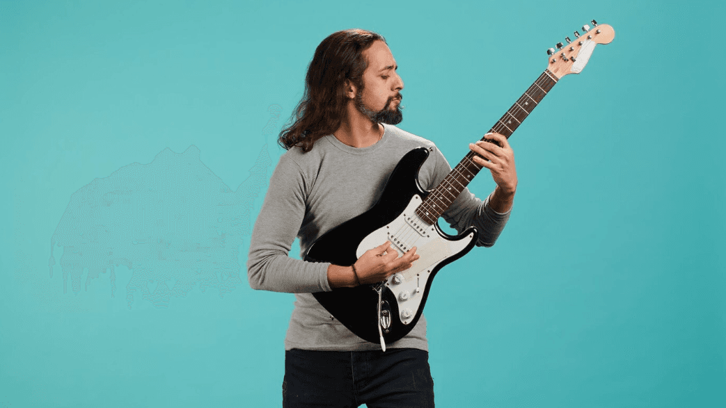 Guitarrista con eléctrica negra tocando en un estudio iluminado